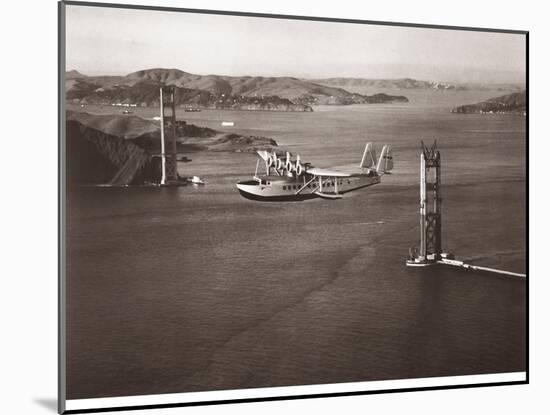 Sikorsky S-42 through the Golden Gate under Construction, San Francisco, 1935-Clyde Sunderland-Mounted Art Print