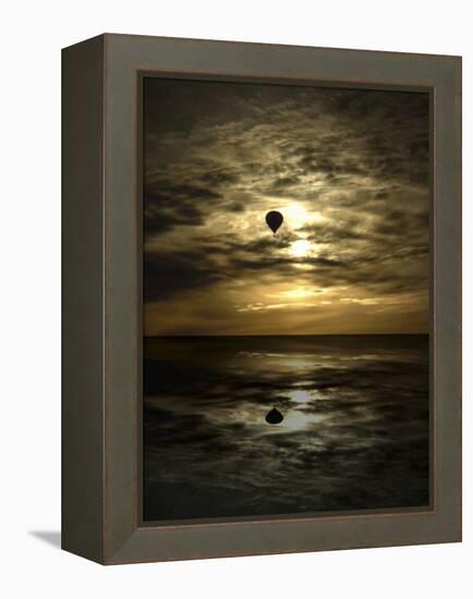 Silhouette of a Hot Air Balloon Over Water-null-Framed Premier Image Canvas