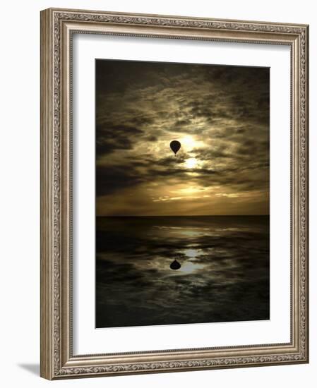 Silhouette of a Hot Air Balloon Over Water-null-Framed Photographic Print