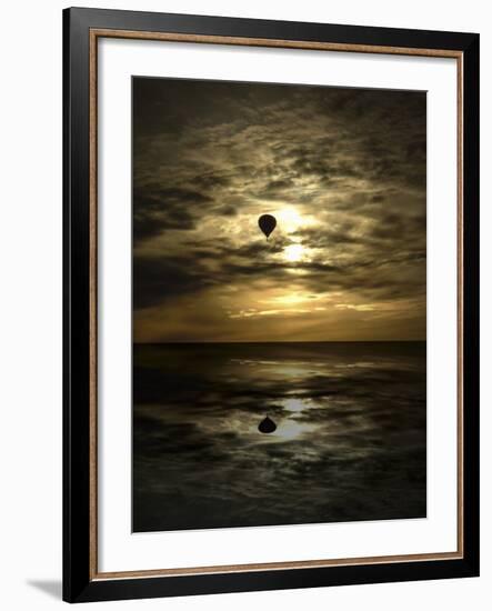 Silhouette of a Hot Air Balloon Over Water-null-Framed Photographic Print