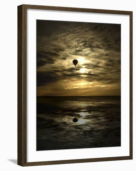 Silhouette of a Hot Air Balloon Over Water-null-Framed Photographic Print