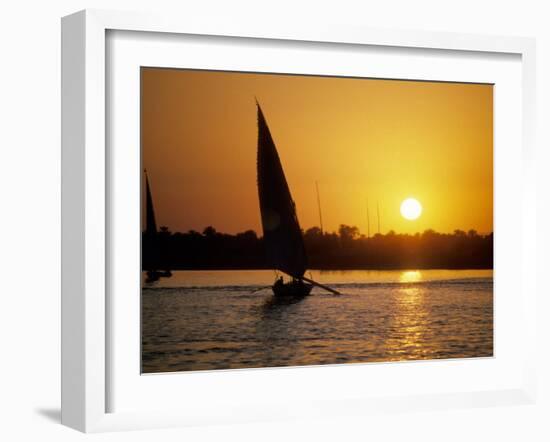 Silhouette of a traditional Egyptian Falucca, Nile River, Luxor, Egypt-Janis Miglavs-Framed Photographic Print