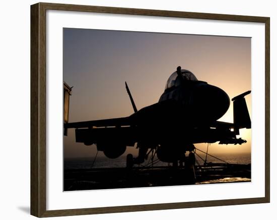 Silhouette of a US Navy F/A-18E Super Hornet on the Flight Deck of USS Nimitz-Stocktrek Images-Framed Photographic Print