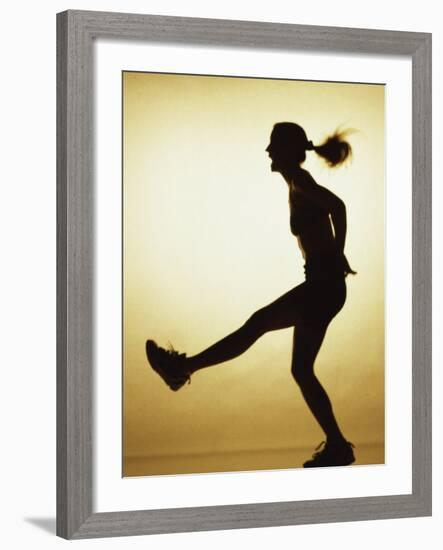 Silhouette of a Young Woman Exercising-null-Framed Photographic Print