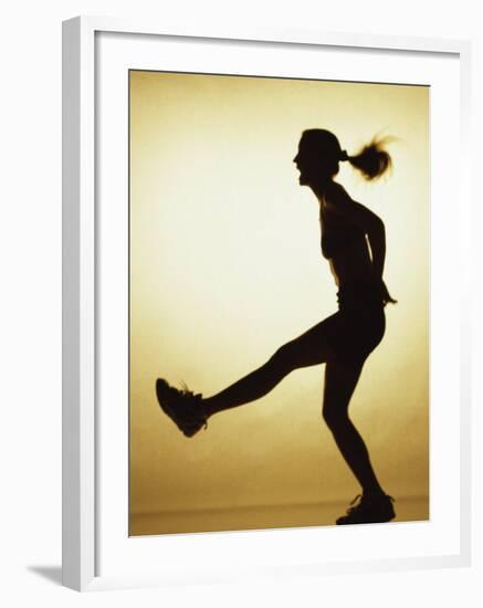 Silhouette of a Young Woman Exercising-null-Framed Photographic Print