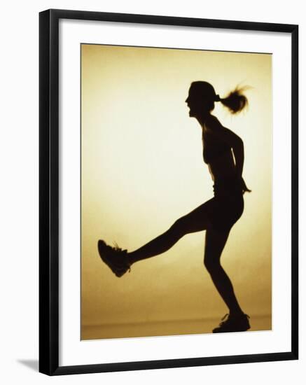 Silhouette of a Young Woman Exercising-null-Framed Photographic Print