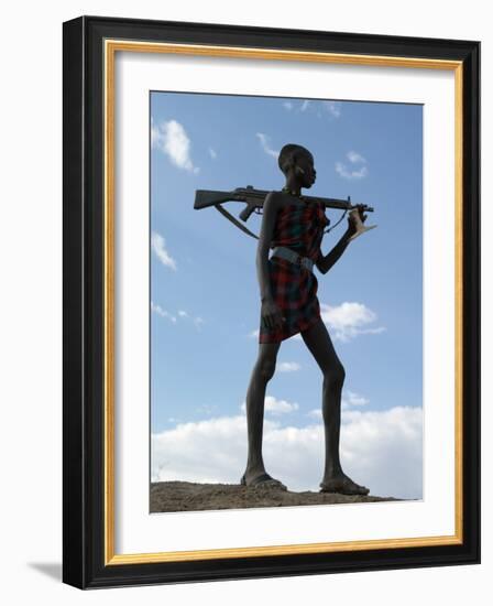 Silhouette of an Armed Nyag'Atom Herdsman on the Banks of the Omo River, Ethiopia-Nigel Pavitt-Framed Photographic Print