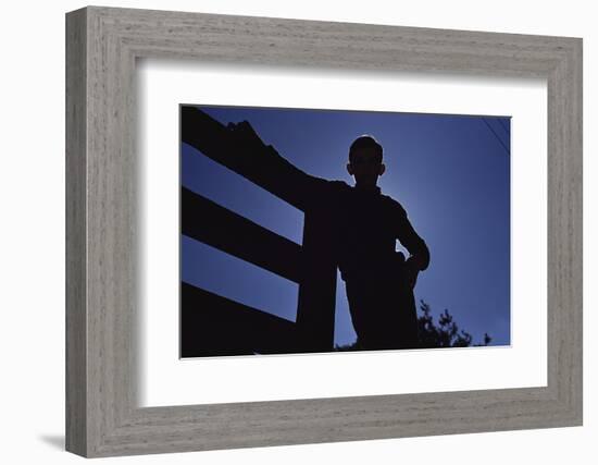 Silhouette of Boy Leaning Against Fence-William P. Gottlieb-Framed Photographic Print