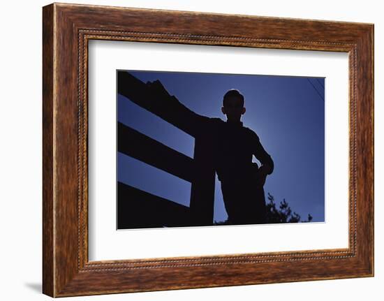 Silhouette of Boy Leaning Against Fence-William P. Gottlieb-Framed Photographic Print