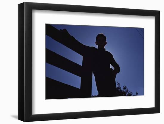 Silhouette of Boy Leaning Against Fence-William P. Gottlieb-Framed Photographic Print