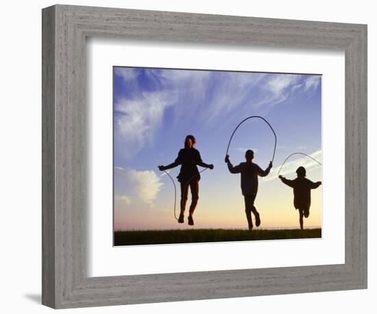 Silhouette of Children Jumping Rope Outdoors-Mitch Diamond-Framed Photographic Print