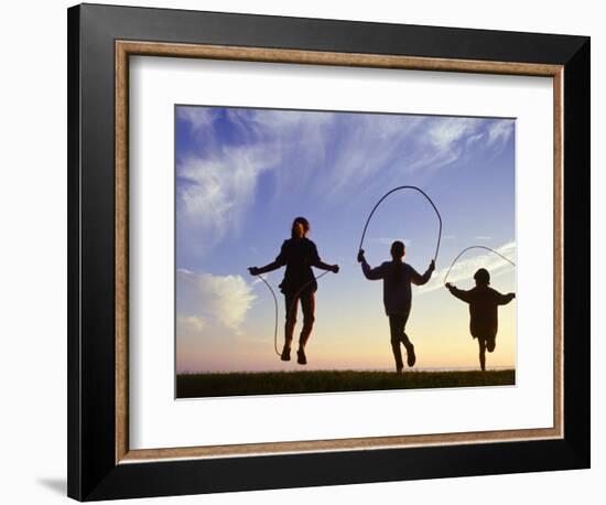 Silhouette of Children Jumping Rope Outdoors-Mitch Diamond-Framed Photographic Print