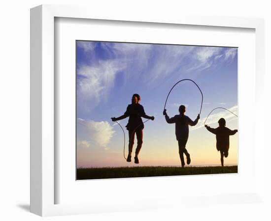 Silhouette of Children Jumping Rope Outdoors-Mitch Diamond-Framed Photographic Print