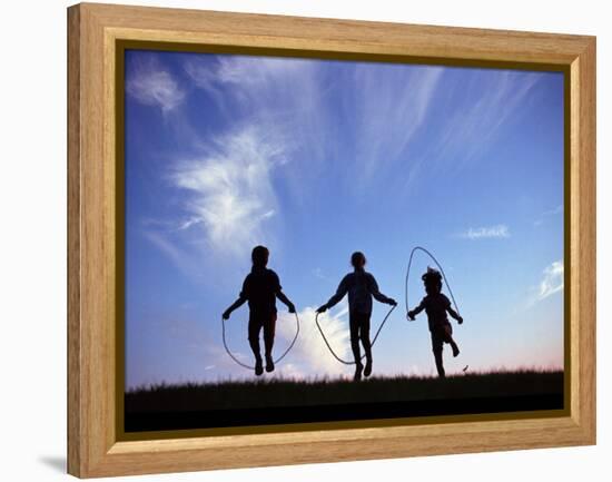 Silhouette of Children Playing Outdoors-Mitch Diamond-Framed Premier Image Canvas