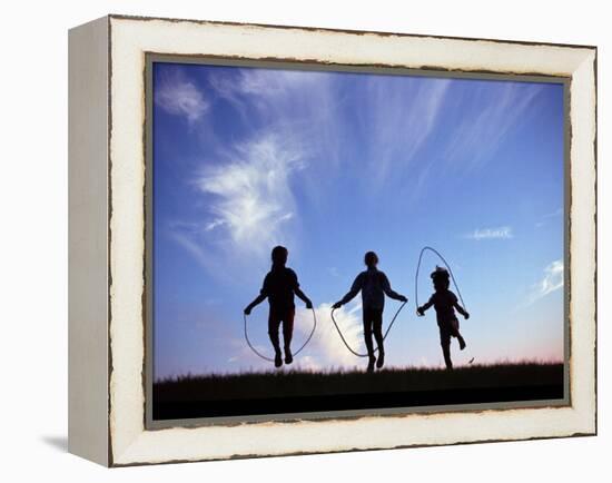 Silhouette of Children Playing Outdoors-Mitch Diamond-Framed Premier Image Canvas