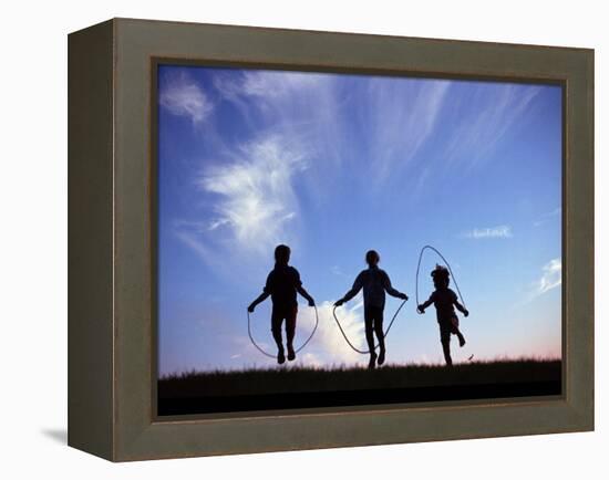 Silhouette of Children Playing Outdoors-Mitch Diamond-Framed Premier Image Canvas