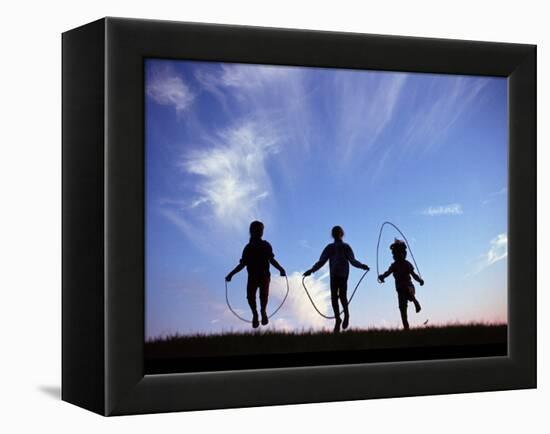 Silhouette of Children Playing Outdoors-Mitch Diamond-Framed Premier Image Canvas