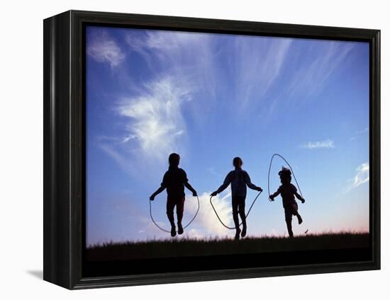 Silhouette of Children Playing Outdoors-Mitch Diamond-Framed Premier Image Canvas