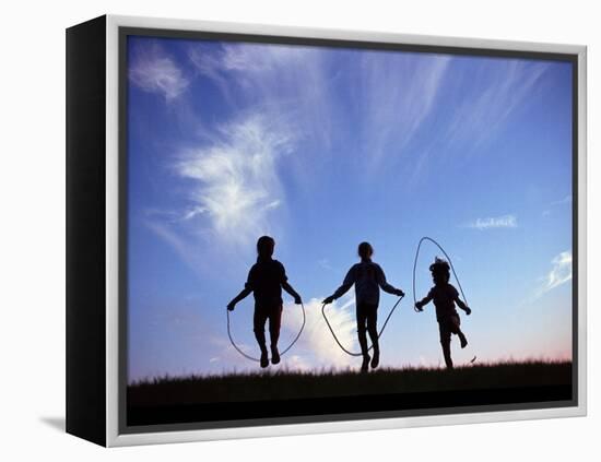 Silhouette of Children Playing Outdoors-Mitch Diamond-Framed Premier Image Canvas