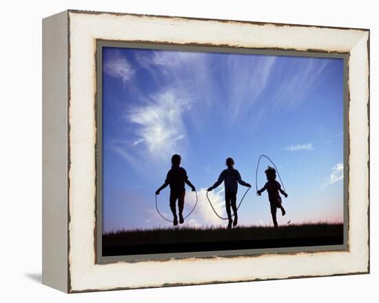 Silhouette of Children Playing Outdoors-Mitch Diamond-Framed Premier Image Canvas