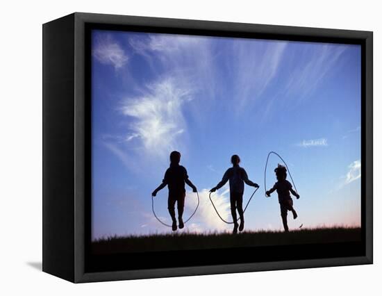 Silhouette of Children Playing Outdoors-Mitch Diamond-Framed Premier Image Canvas