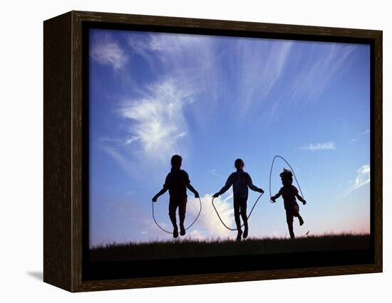 Silhouette of Children Playing Outdoors-Mitch Diamond-Framed Premier Image Canvas