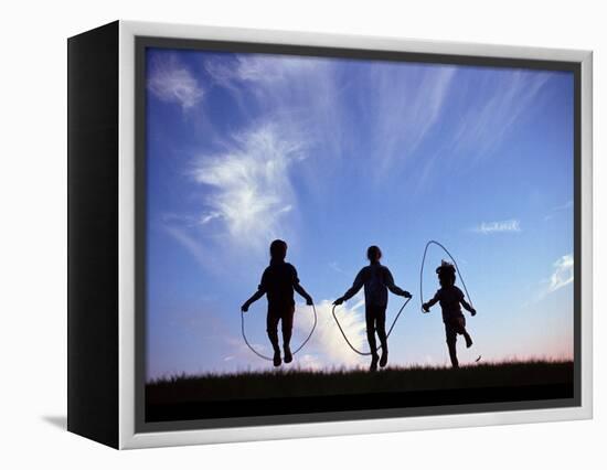 Silhouette of Children Playing Outdoors-Mitch Diamond-Framed Premier Image Canvas