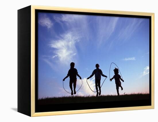 Silhouette of Children Playing Outdoors-Mitch Diamond-Framed Premier Image Canvas