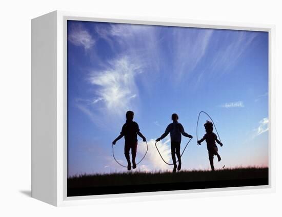 Silhouette of Children Playing Outdoors-Mitch Diamond-Framed Premier Image Canvas