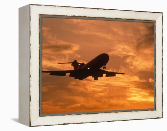 Silhouette of Commercial Airplane at Sunset-Mitch Diamond-Framed Premier Image Canvas