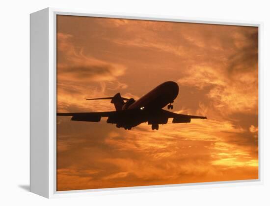 Silhouette of Commercial Airplane at Sunset-Mitch Diamond-Framed Premier Image Canvas