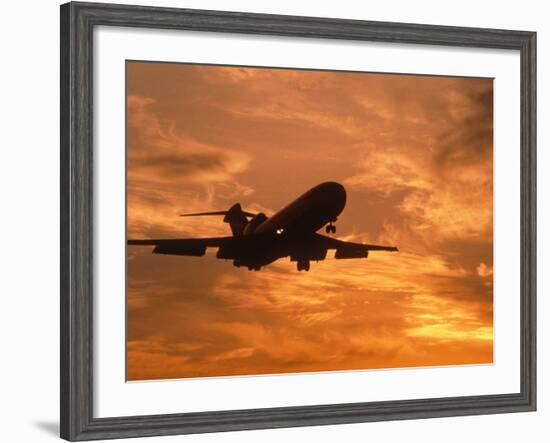 Silhouette of Commercial Airplane at Sunset-Mitch Diamond-Framed Photographic Print