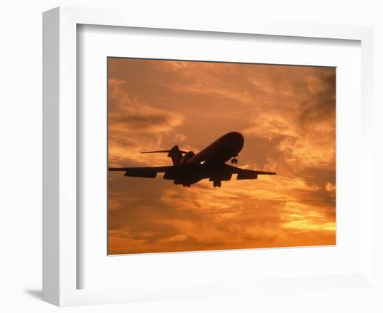Silhouette of Commercial Airplane at Sunset-Mitch Diamond-Framed Photographic Print