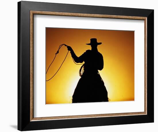 Silhouette of Cowboy on Horse Holding Rope-Darrell Gulin-Framed Photographic Print