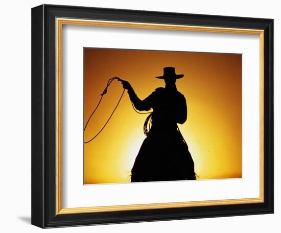 Silhouette of Cowboy on Horse Holding Rope-Darrell Gulin-Framed Photographic Print