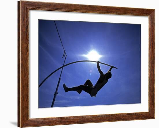 Silhouette of Male Pole Vaulter-Steven Sutton-Framed Photographic Print