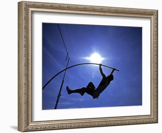 Silhouette of Male Pole Vaulter-Steven Sutton-Framed Photographic Print