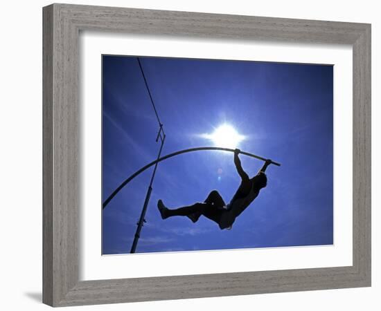 Silhouette of Male Pole Vaulter-Steven Sutton-Framed Photographic Print