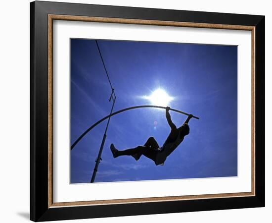 Silhouette of Male Pole Vaulter-Steven Sutton-Framed Photographic Print