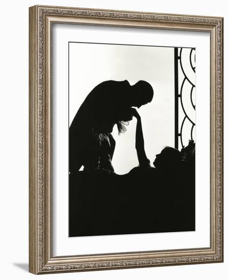 Silhouette of Man Kissing Reclining Woman's Hand-null-Framed Photo