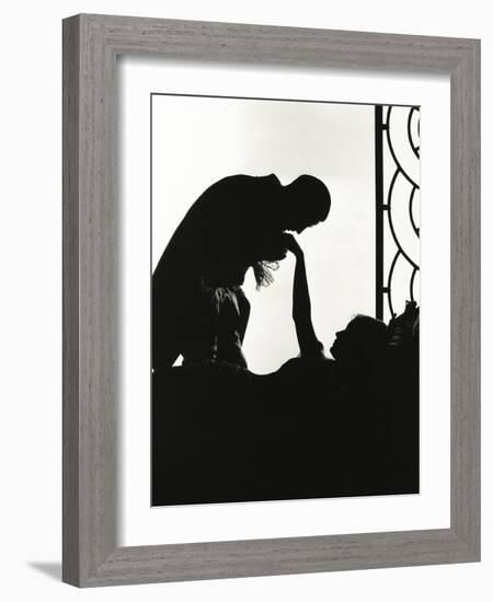 Silhouette of Man Kissing Reclining Woman's Hand-null-Framed Photo