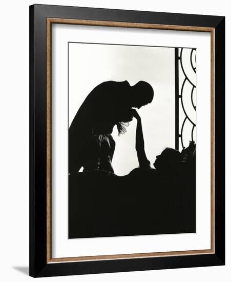 Silhouette of Man Kissing Reclining Woman's Hand-null-Framed Photo