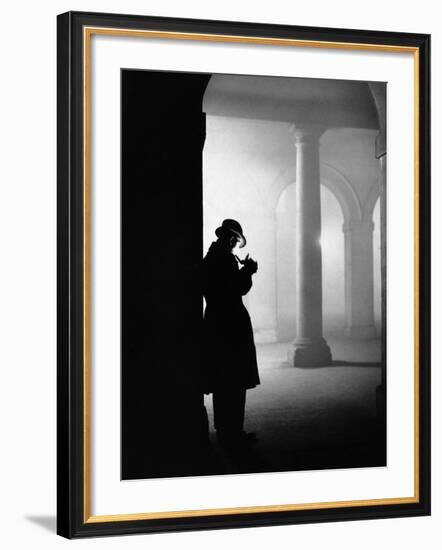 Silhouette of Man Lighting Pipe-null-Framed Photographic Print