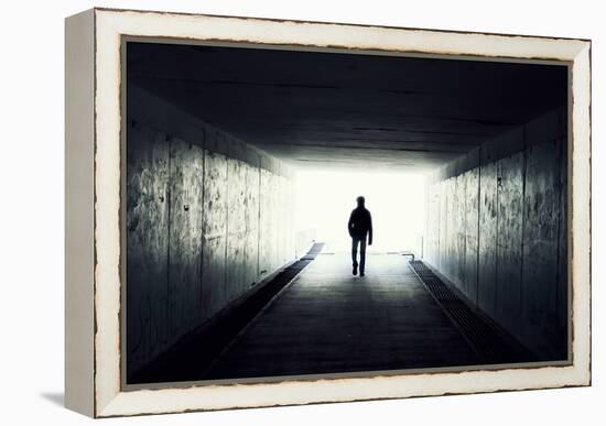 Silhouette Of Man Walking In Tunnel. Light At End Of Tunnel-Gladkov-Framed Stretched Canvas