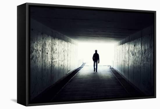 Silhouette Of Man Walking In Tunnel. Light At End Of Tunnel-Gladkov-Framed Stretched Canvas