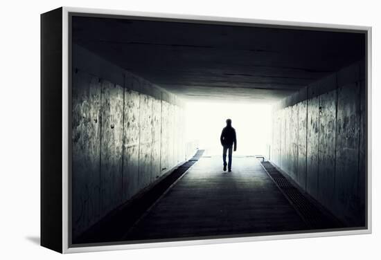 Silhouette Of Man Walking In Tunnel. Light At End Of Tunnel-Gladkov-Framed Stretched Canvas