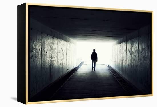 Silhouette Of Man Walking In Tunnel. Light At End Of Tunnel-Gladkov-Framed Stretched Canvas