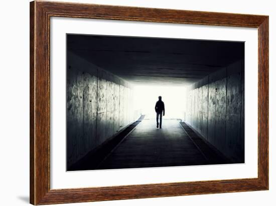 Silhouette Of Man Walking In Tunnel. Light At End Of Tunnel-Gladkov-Framed Art Print