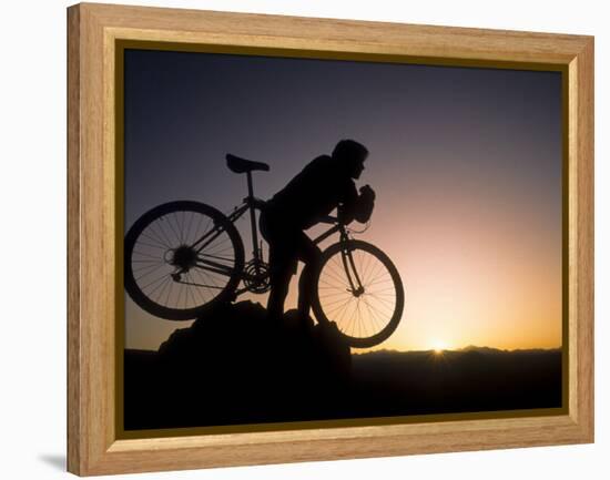 Silhouette of Mountain Biker at the Summit During Sunrise-null-Framed Premier Image Canvas