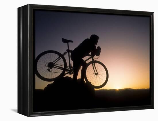 Silhouette of Mountain Biker at the Summit During Sunrise-null-Framed Premier Image Canvas